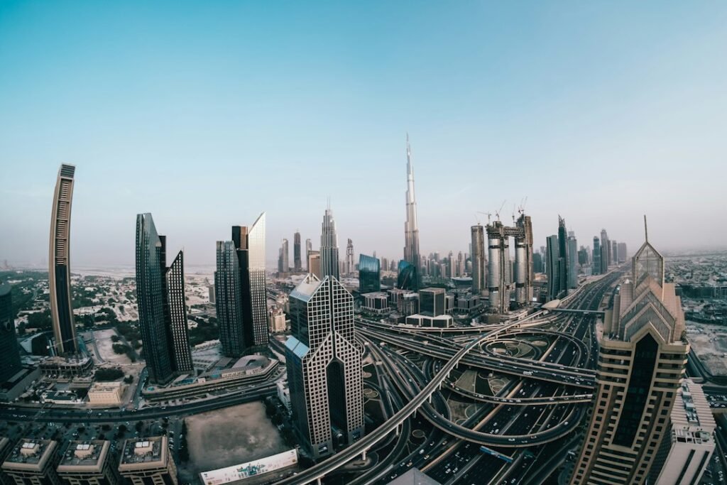 Traffic on a Dubai highway with the city skyline behind — car registration renewal in Dubai