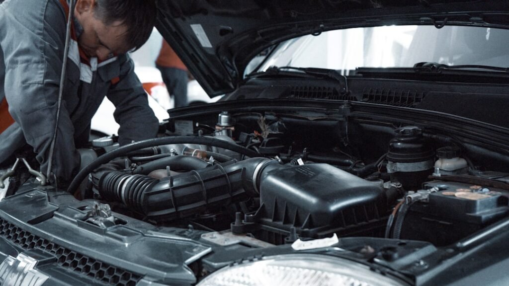 A mechanic inspecting a car engine — RTA vehicle inspection in Dubai